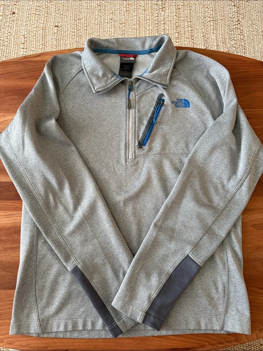 The North Face Men's Light Gray Half-Zip Sweater with Blue Accents